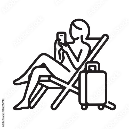 Woman relaxing on a beach chair using a smartphone with travel luggage nearby