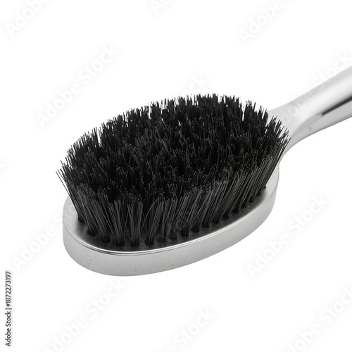 Tool for Grooming With a Black Bristle Brush and Metal Handle Shown up Close