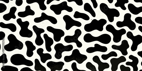 A seamless pattern of irregular black spots on a white background