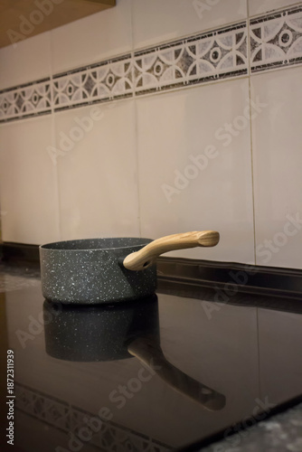 the saucepan is on the electric stove