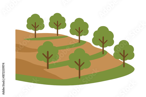 Trees on a hillside with sloped land and green patches showing nature's design in an outdoor setting