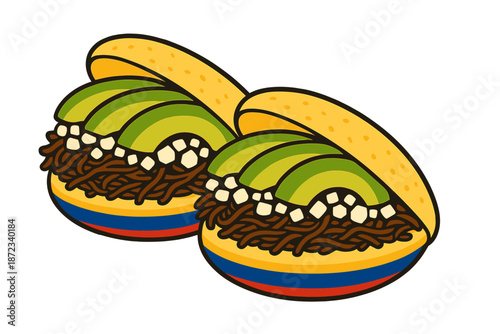 Two arepas filled with shredded meat and avocado served on a colorful plate in a restaurant setting during lunchtime