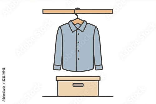 Shirt hanging on a hanger above a storage box in a simple setting