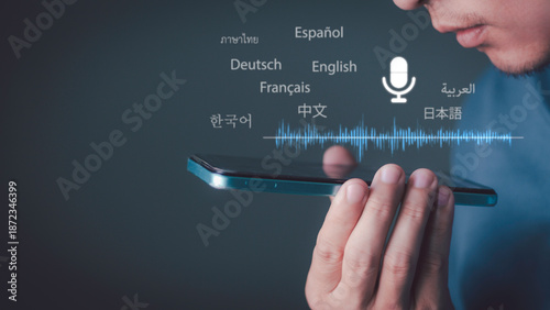 Fotografie Real-time AI voice translation technology, global communication, and voice assistants for business: A man is speaking into a smartphone, with sound waveforms and multilingual icons displayed