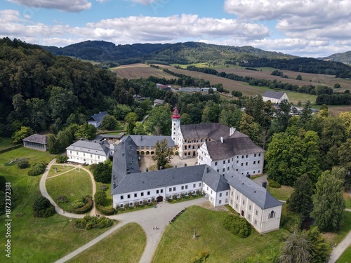 Aerial view of the town of Velké Losiny in the foothills of the Jeseníky Mountains. Drone view of Velké Losiny Castle and the castle garden.