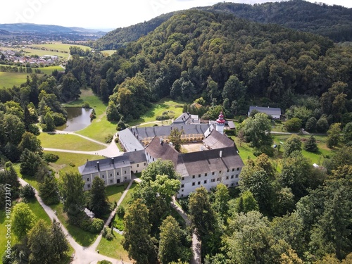 Aerial view of the town of Velké Losiny in the foothills of the Jeseníky Mountains. Drone view of Velké Losiny Castle and the castle garden.