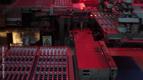 Automated robotic machine processing photovoltaic solar cells on factory production line