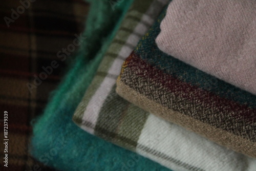 stack of colorful plaid scarves 