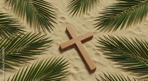 Wooden cross on sandy surface surrounded by palm leaves