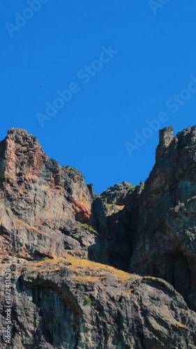 View of rock formations in the Balkan mountains with birds flying around