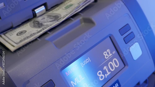 Abstract fast cash counting machine in action with blue light