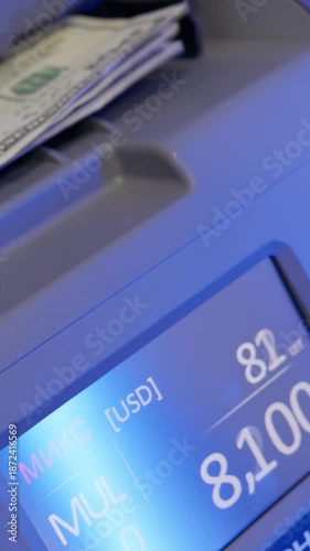 Abstract fast cash counting machine in action with blue light