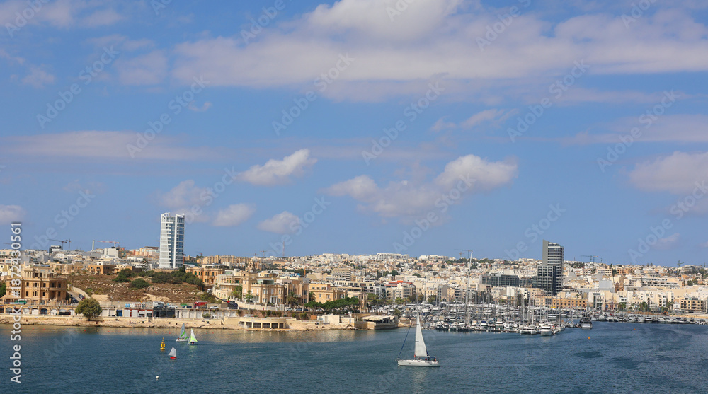 Obraz premium SLIEMA MALTA: Sliema is a town located on the northeast coast of Malta in the Northern Harbour District. It is a major residential and commercial area