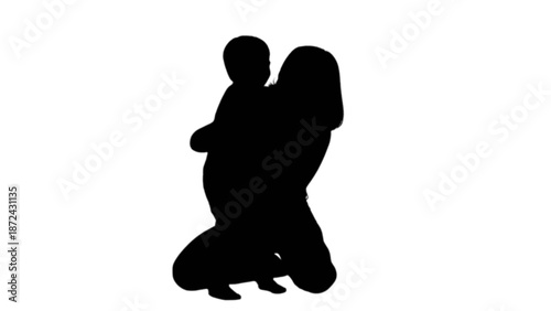A loving mother tenderly embraces her little child in a heartwarming silhouette