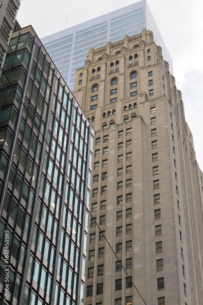 Naklejka premium modern office buildings including heritage Bank of Commerce (Imperial Bank of Commerce headquarters) designed by Pearson and Darling (with York and Sawyer), 1931, 25 King W, Toronto