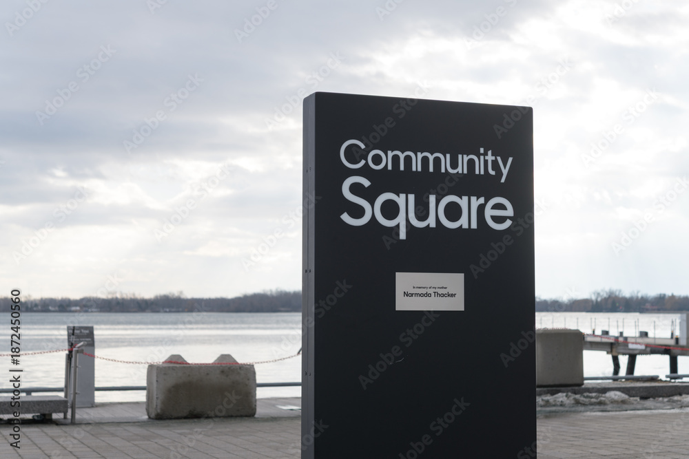 Obraz premium Community Square sign at Harbourfront Centre with view of Toronto Harbor