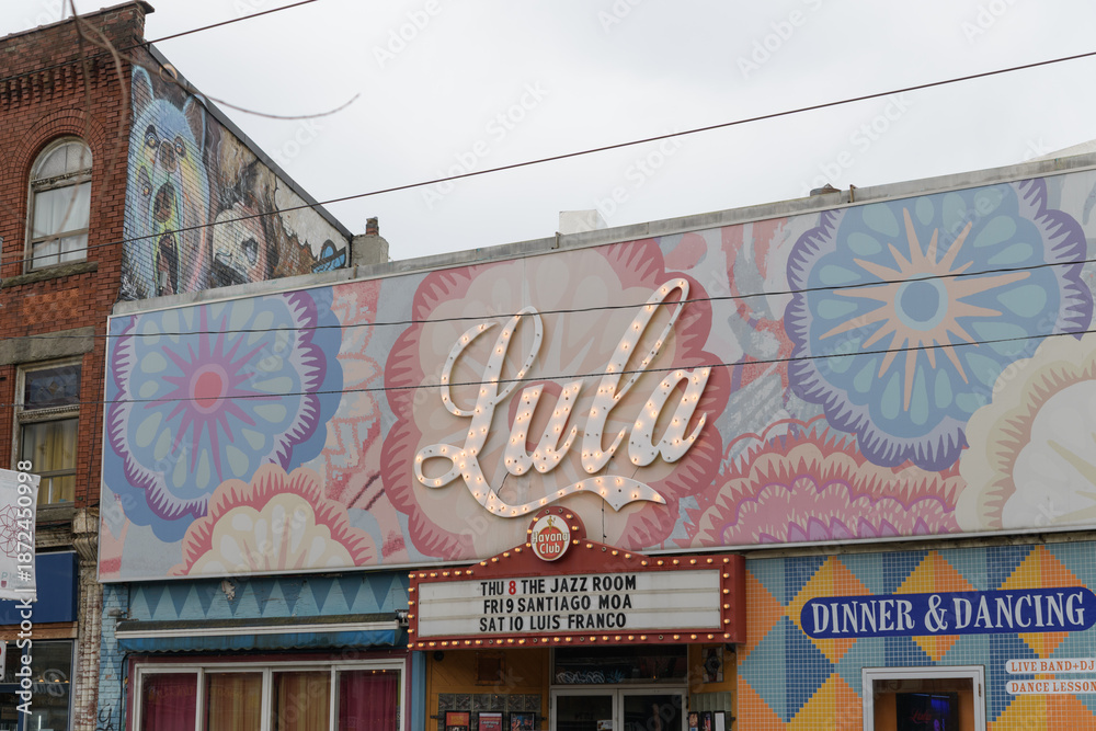 Naklejka premium exterior building facade and sign of Lula Lounge located at 1585 Dundas St W, Toronto