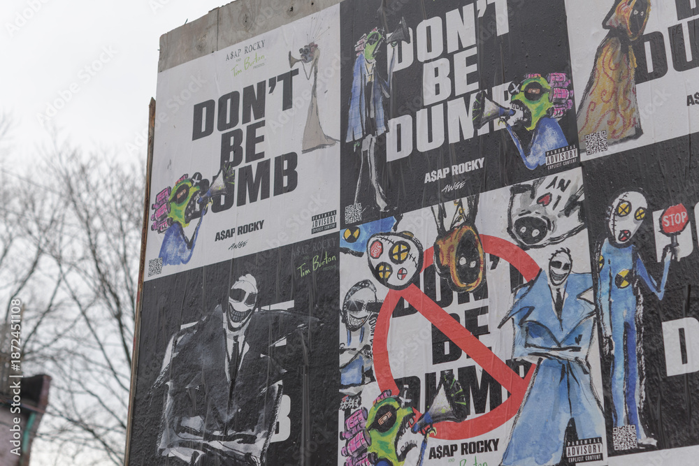 Fototapeta premium street posters on a hoarding in Toronto at Perth Av south of Bloor St W “Don’t Be Dumb