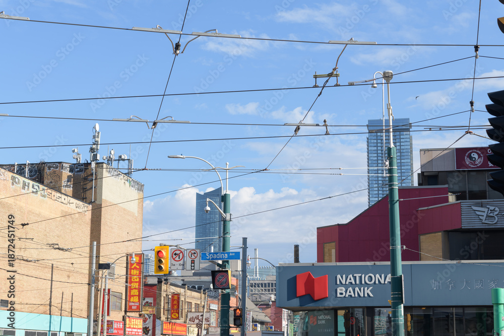 Fototapeta premium wide view looking east on Dundas St W at the intersection of Spadina Av (National Bank of Canada branch located at 501 Dundas St W), Toronto