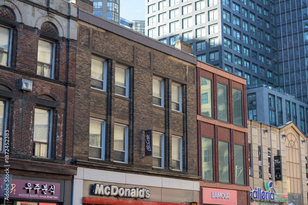Fototapeta premium exterior of historic buildings facing Yonge St incl McDonald's Canada fast food restaurant at 552 Yonge St, Toronto