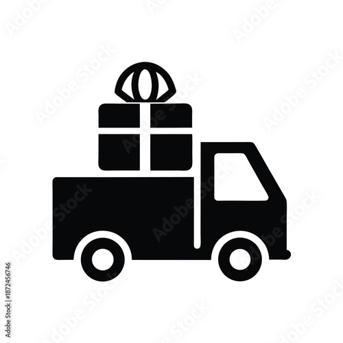 Black silhouette depicts a truck carrying gifts that is ready for prompt delivery
