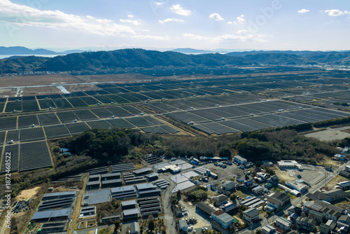 Fotografie Winter aerial view of Setouchi Kirei Solar Power Plant and salt field ruins in Ushimado, Japan