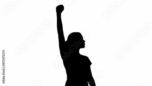 Woman Silhouette with Raised Fist in Triumph.