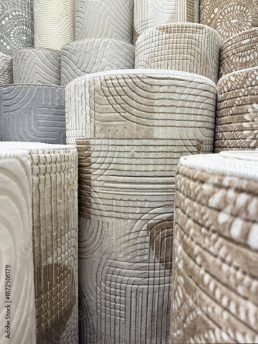 Decorative carpet runners with embossed texture displayed indoors. Neutral colors create warm atmosphere, home comfort concept, modern interior design and textile flooring.