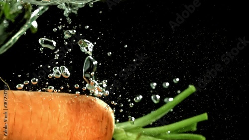 Super slow motion fresh carrots . Filmed on a high-speed camera at 1000 fps. High quality FullHD footage