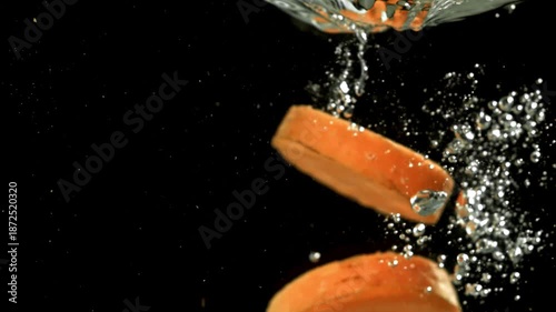 Super slow motion carrot slices. Filmed on a high-speed camera at 1000 fps. High quality FullHD footage
