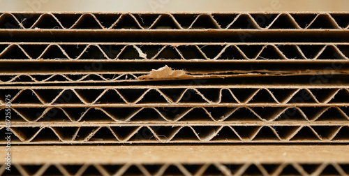 Close-up of corrugated cardboard with visible wear and tear