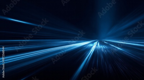 Blue streaks of light suggest fast movement on a dark road.