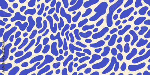 Abstract blue and cream pattern with organic irregular shaped spots