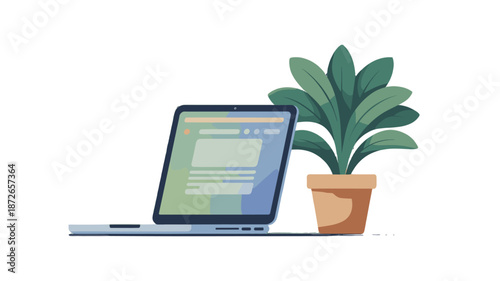 An office laptop next to a potted plant, offering a glimpse into the work environment.