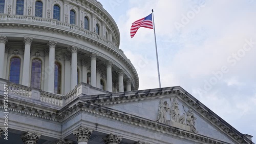 Historic Capitol by the national flag. Capitol dome as symbol of law. Washington monument architecture. Washington DC. US Senate. Federal government in the nation capital. USA symbol
