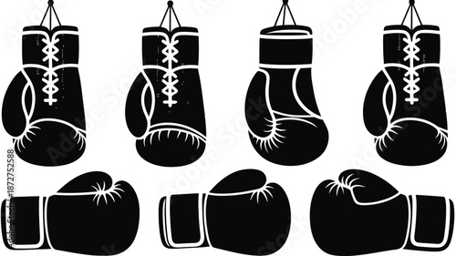 Black and white of hanging and lying boxing gloves