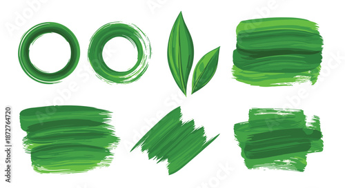 Set of vibrant green artistic elements includes brush strokes, circles, and fresh leaves for eco friendly and botanical design projects.