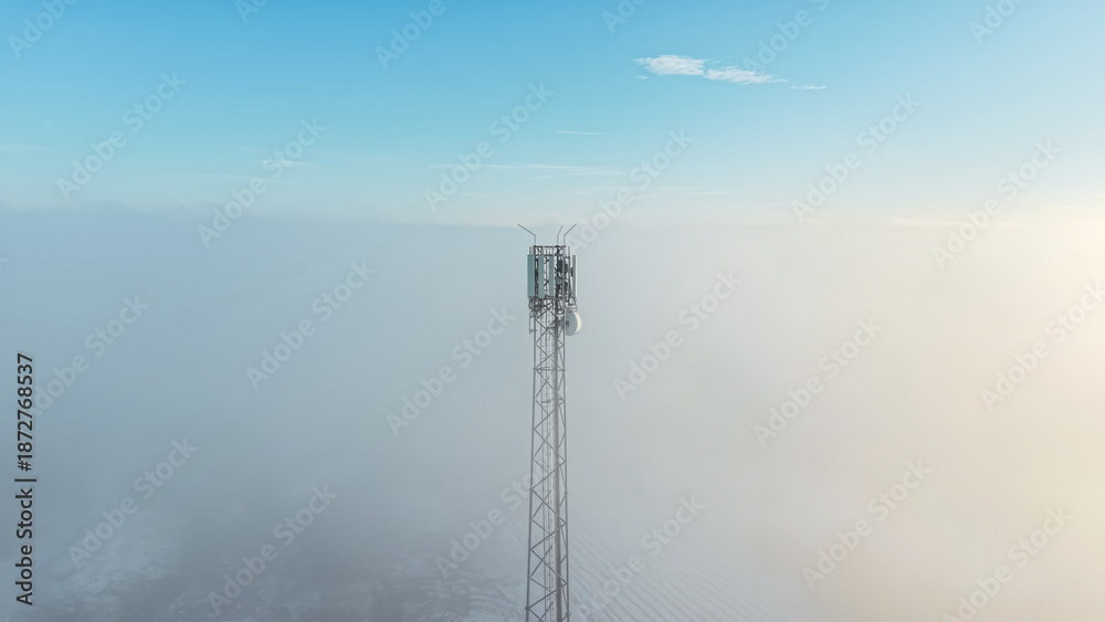 Fototapeta premium Foggy view of a tall mobile phone mast
