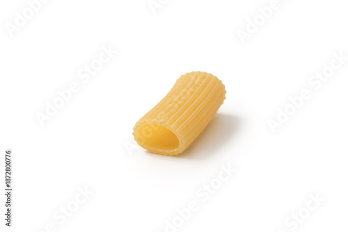Italian dry rigatoni pasta over white background with shadow