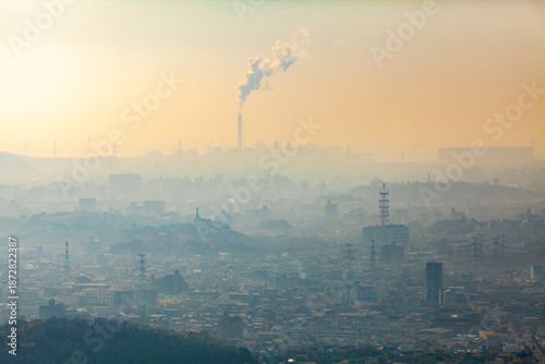 Wide view of town enveloped in smog pollution