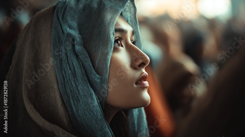 Hopeful gaze: An ethnic woman wearing a headscarf in quiet contemplation
