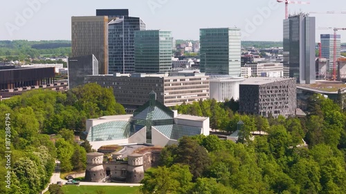 historical site green cover parked truck tall buildings glass windows business district background luxembourg city view urban landscape cityscape development 