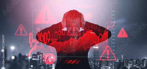 Fotografija Stressed trader holding head with crashing red stock market char