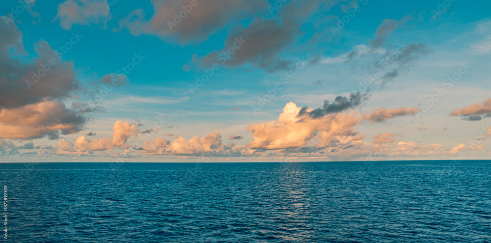 Obraz premium Ecology meditation picturesque ocean horizon nature scene sunset with vibrant clouds sky calm water inspiring landscape serene tropical seascape relaxing summer wallpaper panoramic travel background
