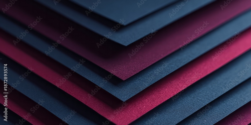 Obraz premium Dark blue and maroon paper layers create a clean chevron pattern.