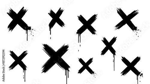 A collection of black spray-painted crosses with dripping paint effects on a white background.