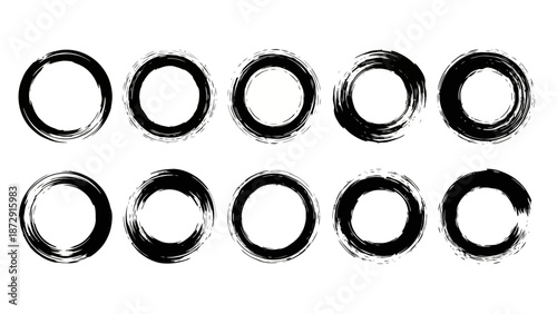 A collection of ten hand-drawn, imperfect black ink circles or brush strokes on a white background, representing Zen ensos.