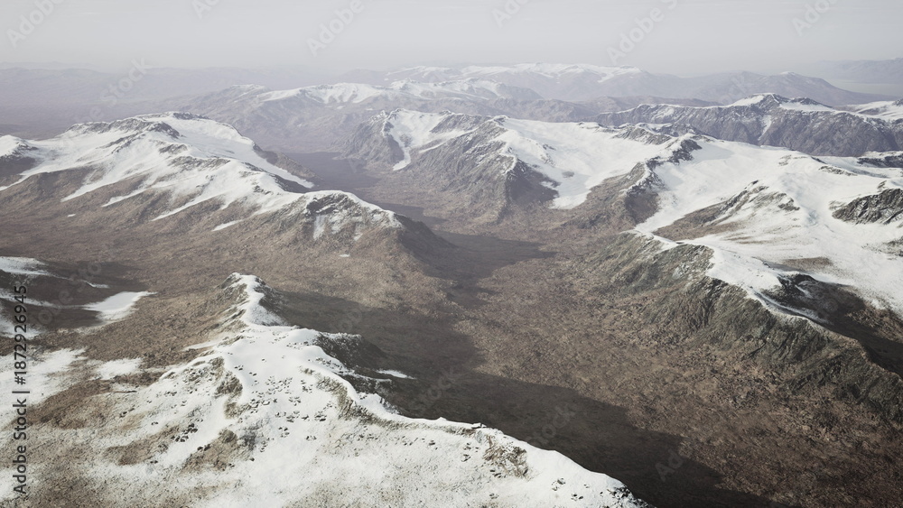 Obraz premium Majestic snow covered mountains stretch across the horizon, revealing deep valleys and rugged terrain. The quiet winter scene showcases natures beauty and tranquility under a pale sky.