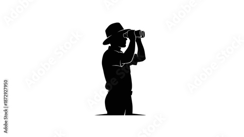 Silhouette of a person using binoculars for observation.