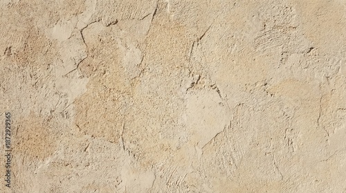 Rough grunge texture of an old stone wall with a brown weathered rock surface and beige concrete material pattern for an architectural background